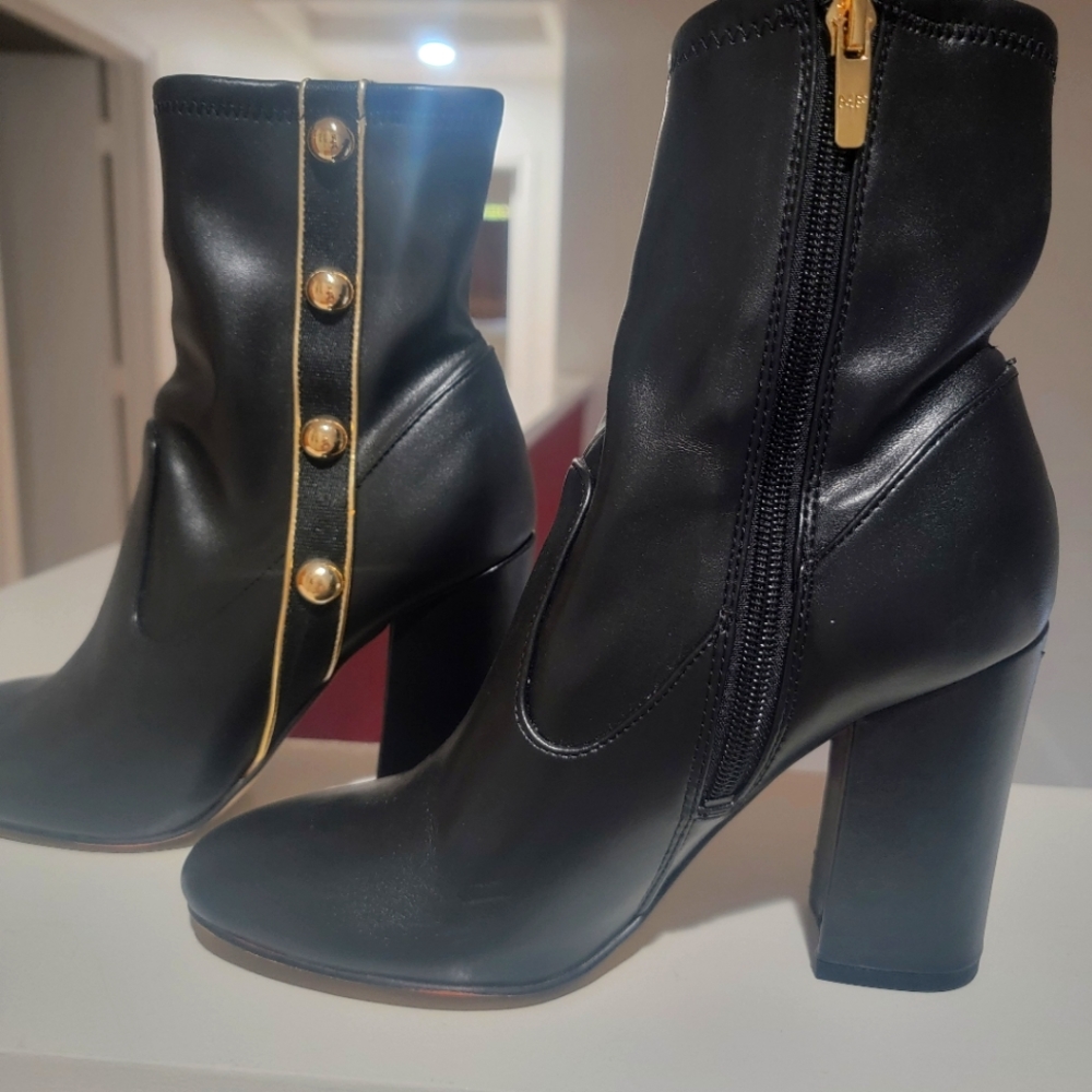 Black boots man made material